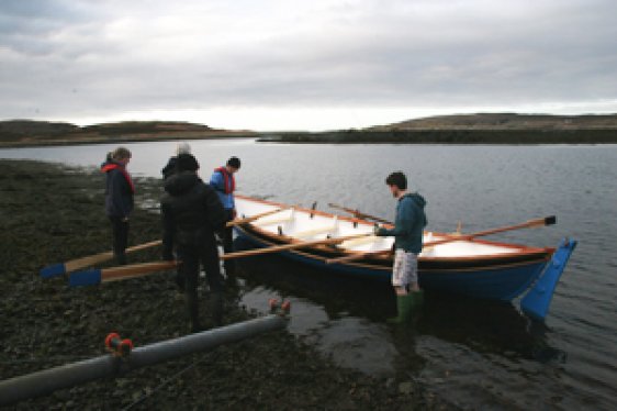 The Achiltibuie community boat 'Coigach Lass' with some of it's rowers, IOTA, February 2012 (photo: Neville Gabie)