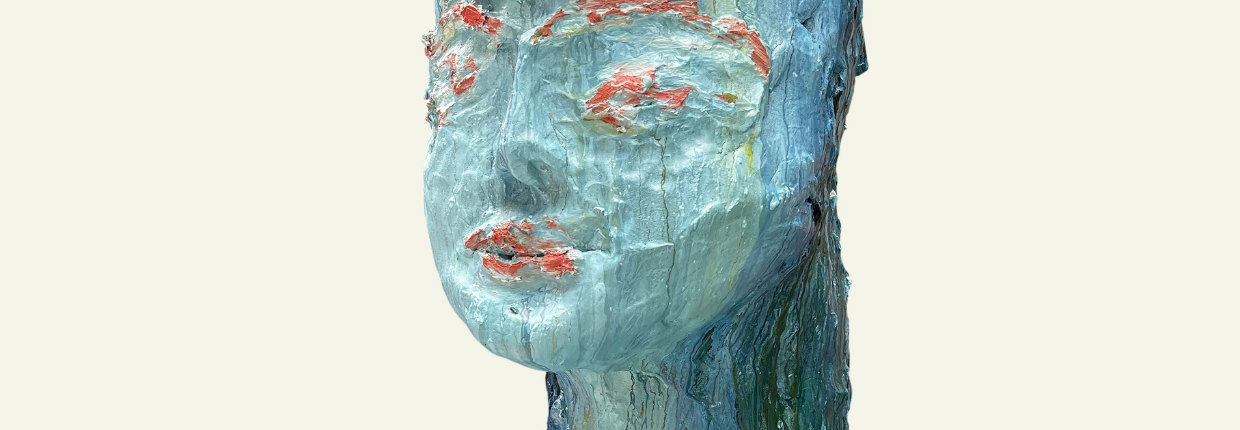 Sculptural image of head in blue and orange.