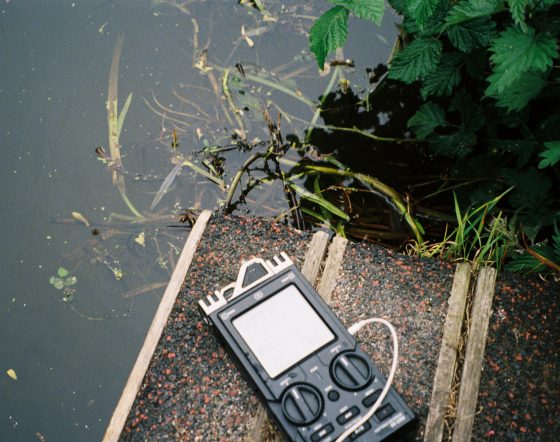 Zoom recorder lies next to canal